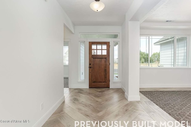 foyer featuring light parquet flooring