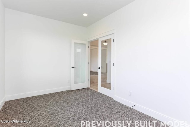 spare room featuring tile patterned floors and french doors