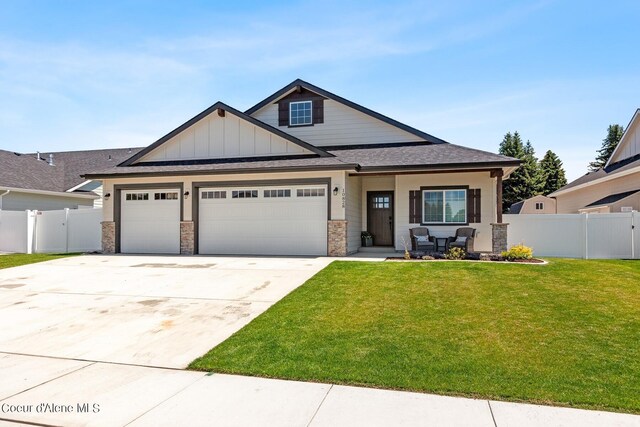 view of front of home featuring a garage and a front lawn