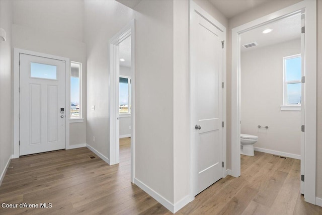 entryway with light hardwood / wood-style floors