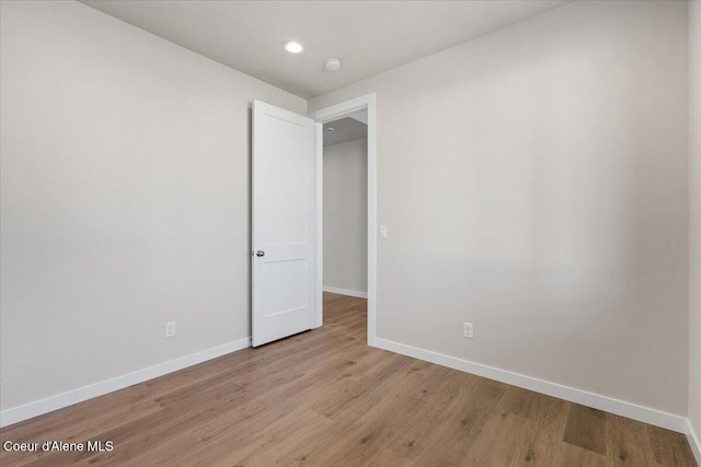 empty room with light hardwood / wood-style floors