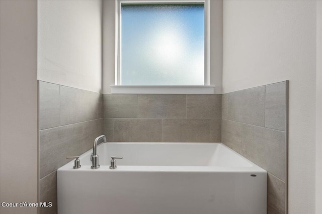 bathroom featuring a tub