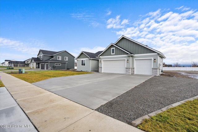 view of front of property featuring a garage and a front lawn