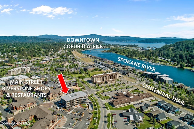 birds eye view of property featuring a water and mountain view