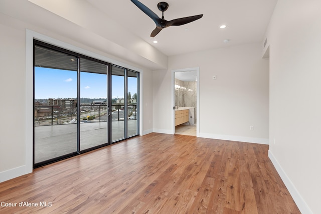 spare room featuring light wood finished floors, ceiling fan, baseboards, and recessed lighting