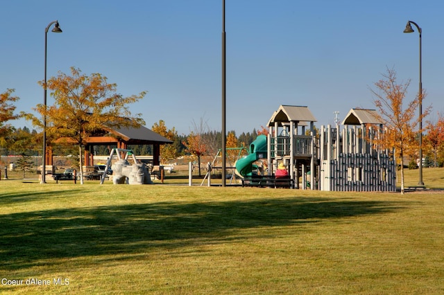 community jungle gym with a yard