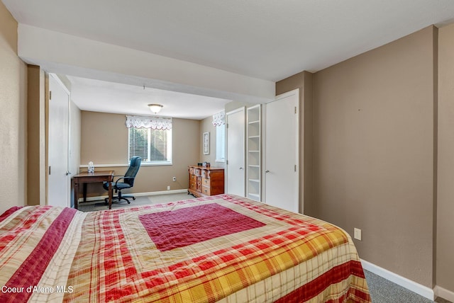 bedroom featuring carpet and baseboards