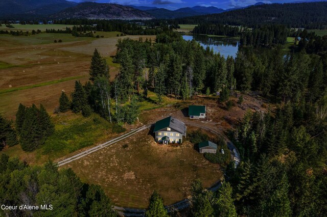 bird's eye view featuring a rural view and a water and mountain view