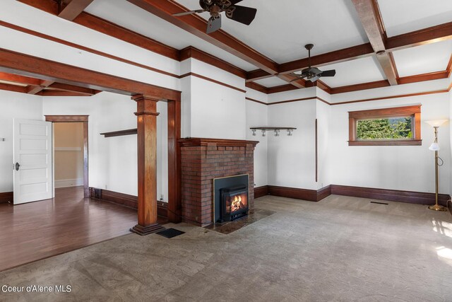 unfurnished living room with hardwood / wood-style flooring, a brick fireplace, coffered ceiling, and ceiling fan