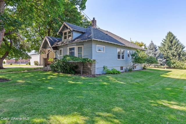 view of property exterior with a lawn