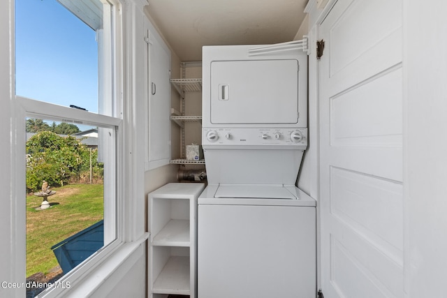 laundry area featuring stacked washer / dryer