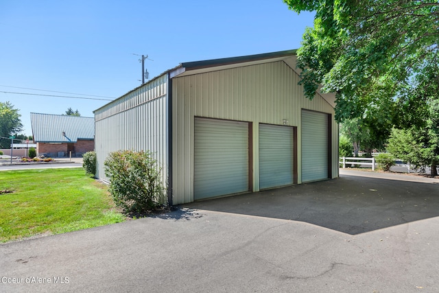 garage with a yard