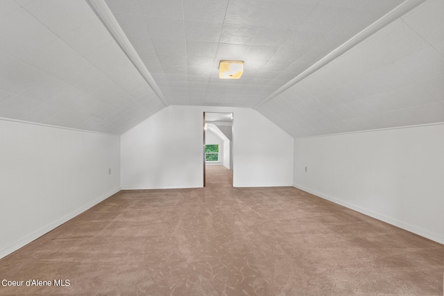 bonus room featuring carpet flooring and vaulted ceiling