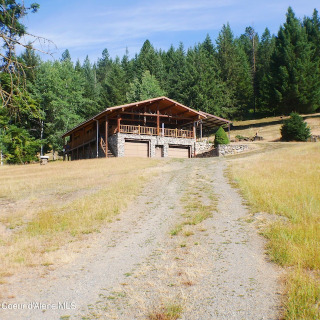 view of front of house with an outbuilding and a garage