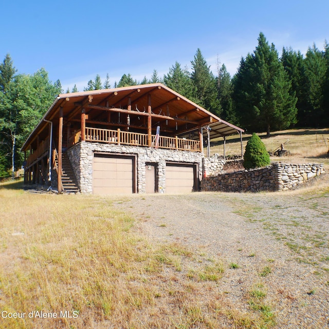 view of property exterior with a garage