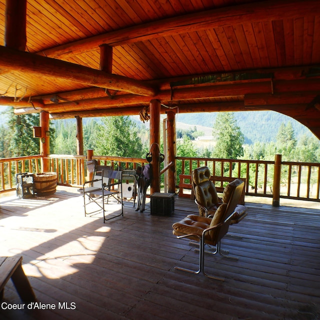 wooden deck with a mountain view