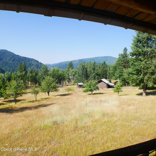 property view of mountains featuring a rural view