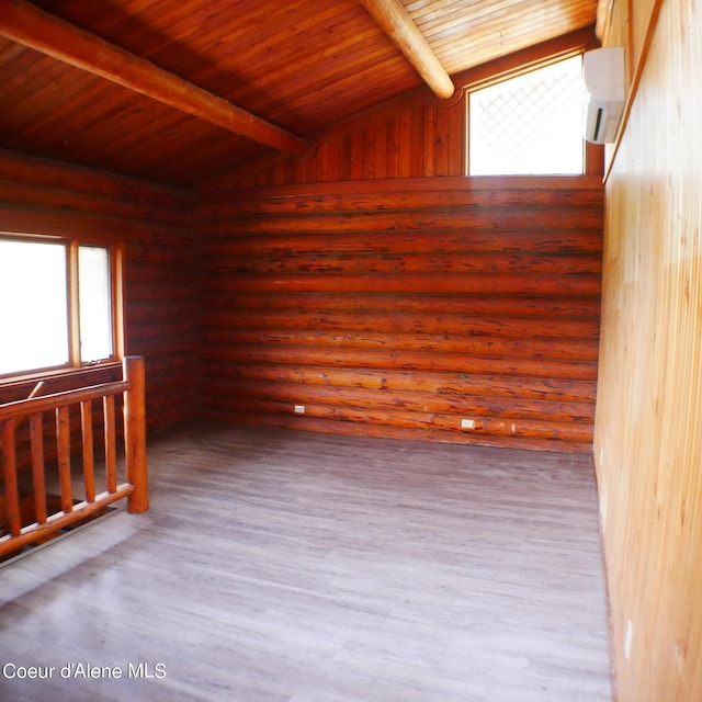 spare room featuring lofted ceiling with beams and wooden ceiling