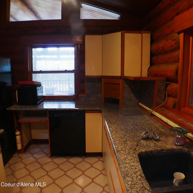 kitchen featuring stone counters, sink, log walls, and black dishwasher