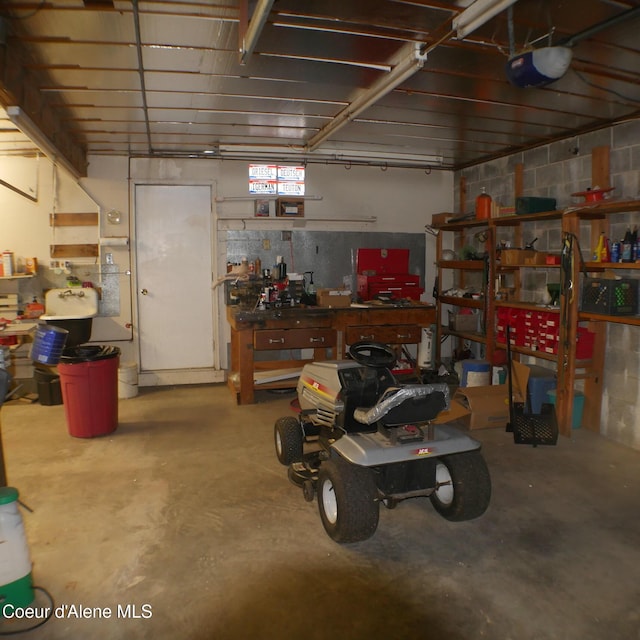 garage featuring a workshop area and a garage door opener