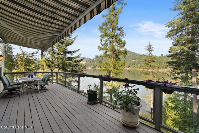 wooden deck with a water view