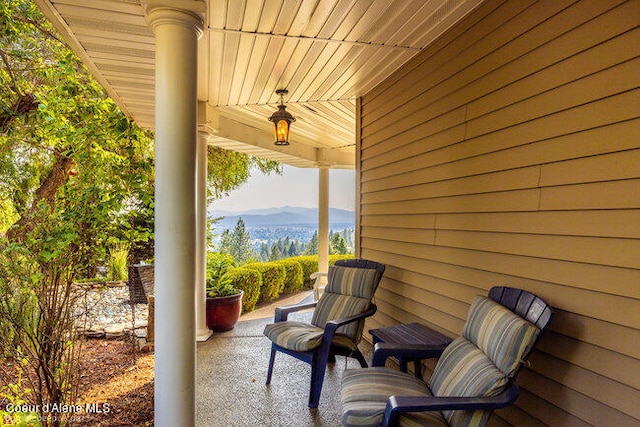 view of patio / terrace featuring a mountain view