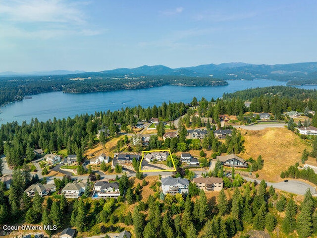 bird's eye view featuring a water and mountain view