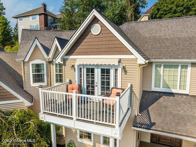 rear view of property featuring french doors