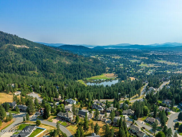 aerial view featuring a water and mountain view