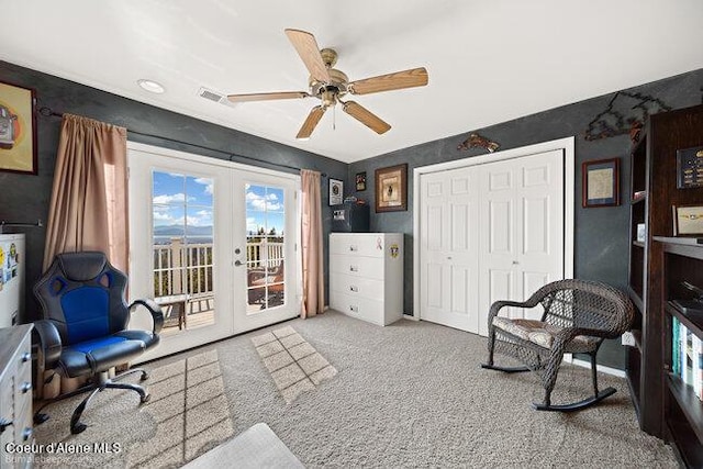 living area with french doors, ceiling fan, visible vents, and carpet floors