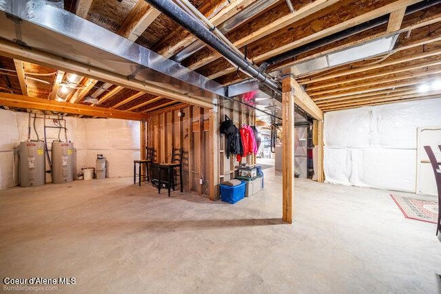 unfinished basement featuring water heater