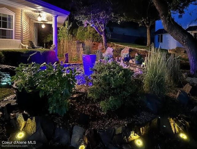 view of yard at twilight