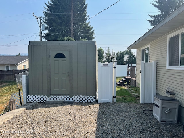 view of shed with fence