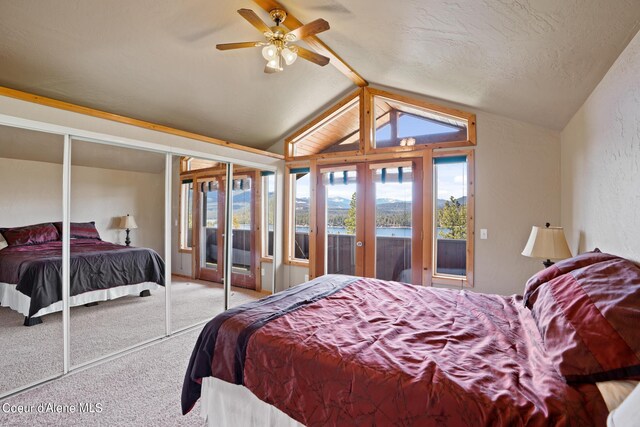 bedroom with carpet flooring, french doors, access to outside, vaulted ceiling, and ceiling fan