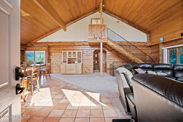 living room featuring beamed ceiling, carpet floors, high vaulted ceiling, and wood ceiling