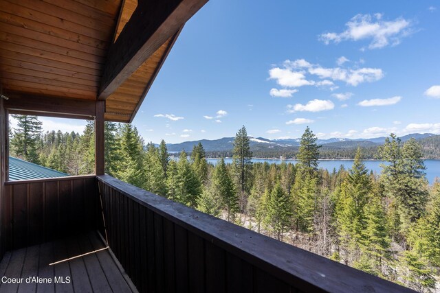 balcony with a water and mountain view