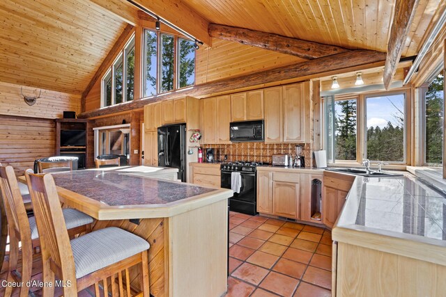 kitchen with sink, black appliances, light brown cabinets, high vaulted ceiling, and beamed ceiling