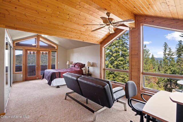 bedroom featuring wood walls, wooden ceiling, light carpet, lofted ceiling, and ceiling fan