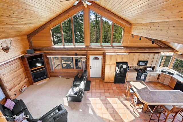 living room with wooden ceiling and lofted ceiling with beams