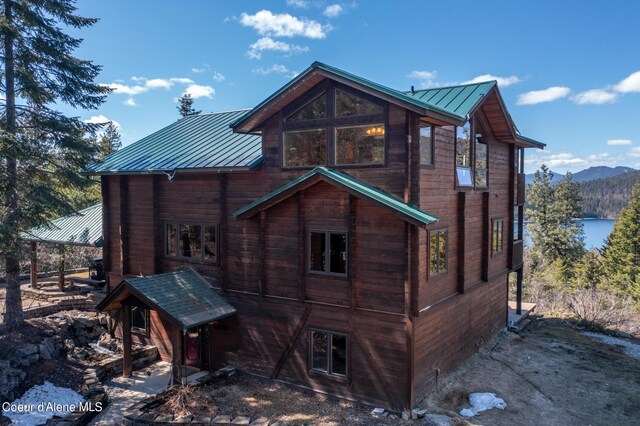 back of property featuring a mountain view