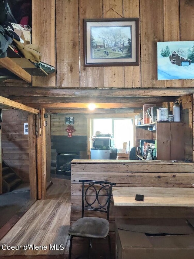 interior space featuring wooden walls and hardwood / wood-style flooring