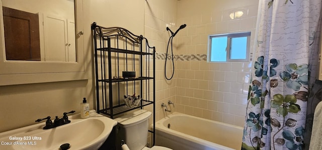 full bathroom with sink, toilet, and shower / bath combo with shower curtain