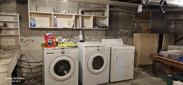 clothes washing area featuring independent washer and dryer