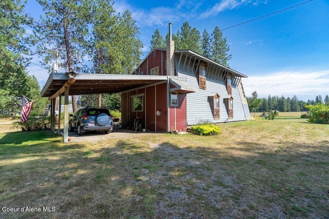 view of property exterior featuring a chimney, a carport, driveway, and a yard