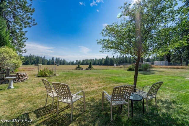 view of yard with a rural view