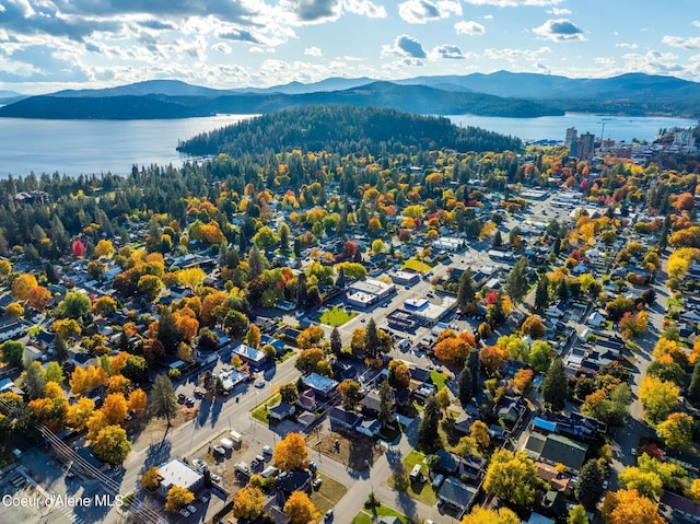 aerial view featuring a water and mountain view