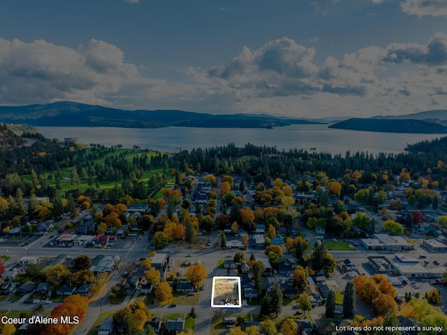 aerial view featuring a water and mountain view