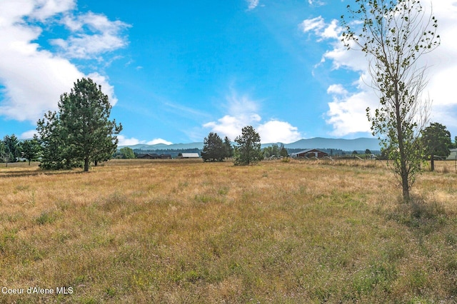 view of mountain feature with a rural view