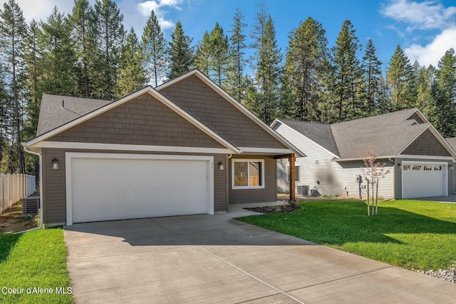 view of front of house with a garage, driveway, and a front yard