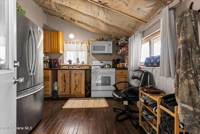 kitchen featuring dark hardwood / wood-style flooring, hanging light fixtures, vaulted ceiling, sink, and white appliances